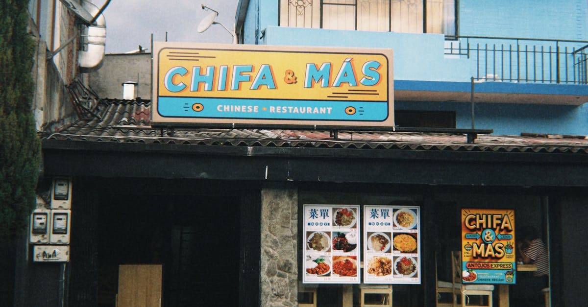 Interior of a typical neighborhood chifa in Lima with red lanterns, formica tables, and a family eating arroz chaufa and wantán soup
