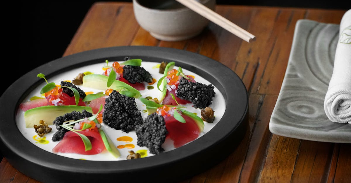 Plate of nikkei-style tiradito of corvina with ají amarillo cream, soy reduction, and microgreens at a Lima restaurant
