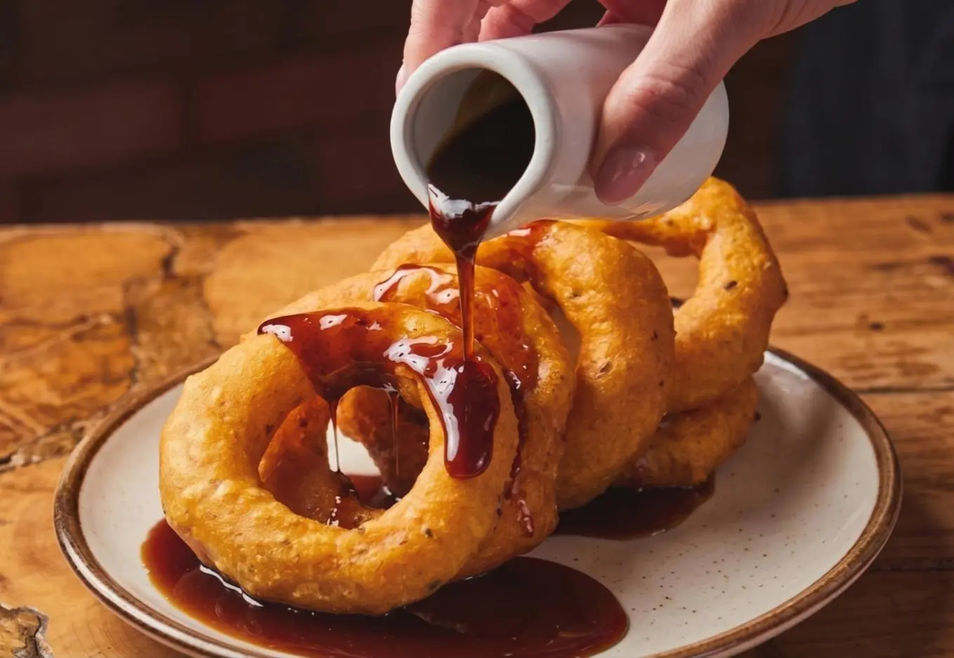 Picarones drizzled with chancaca syrup