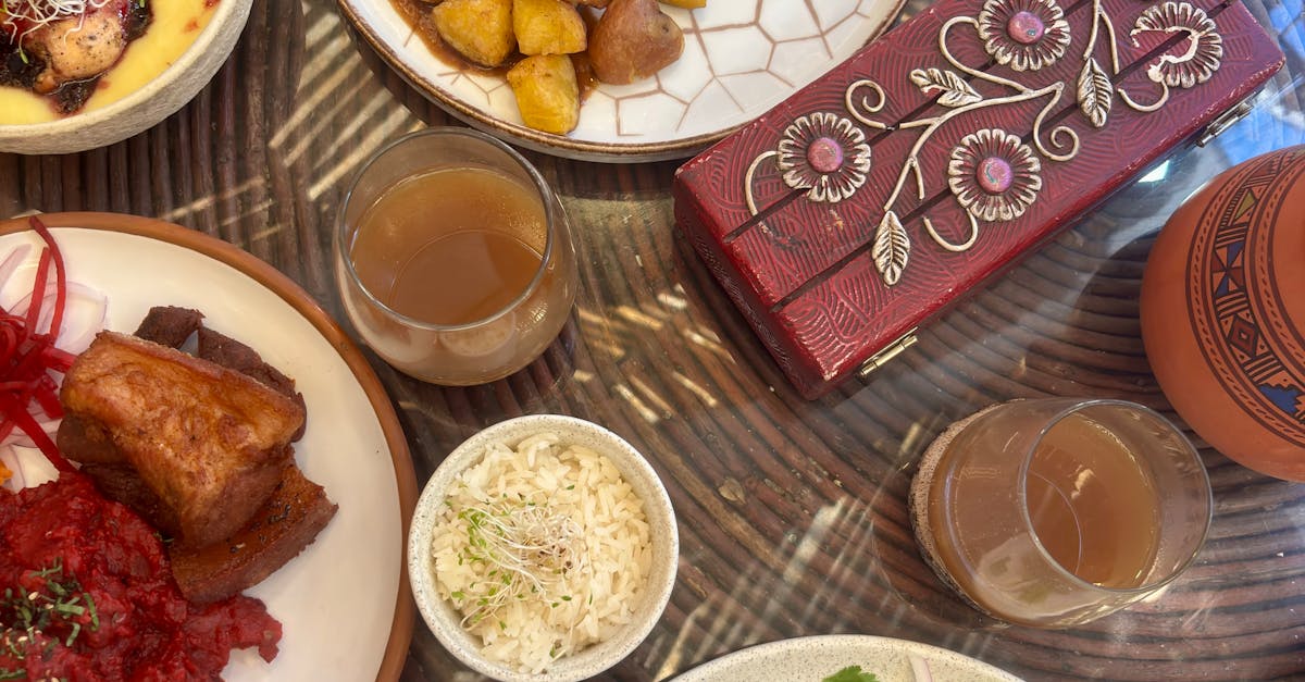 Top-down view of a Peruvian table spread with ceviche, lomo saltado, causa limena, and a glass of chicha morada