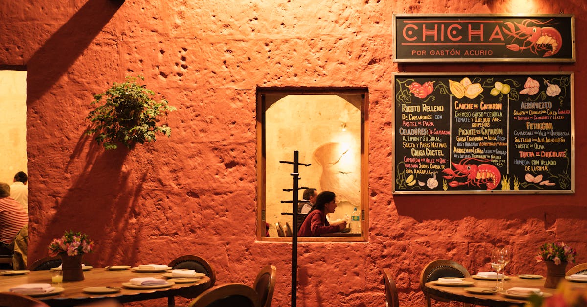 Locals at a Lima cevichería counter at lunch, plates of ceviche and tiradito, the chef visible behind the bar
